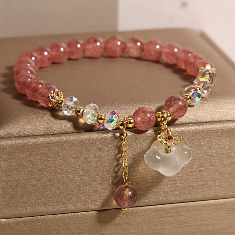 Women's natural crystal bracelet with strawberry quartz beads, white agate beads, and traditional auspicious cloud charm