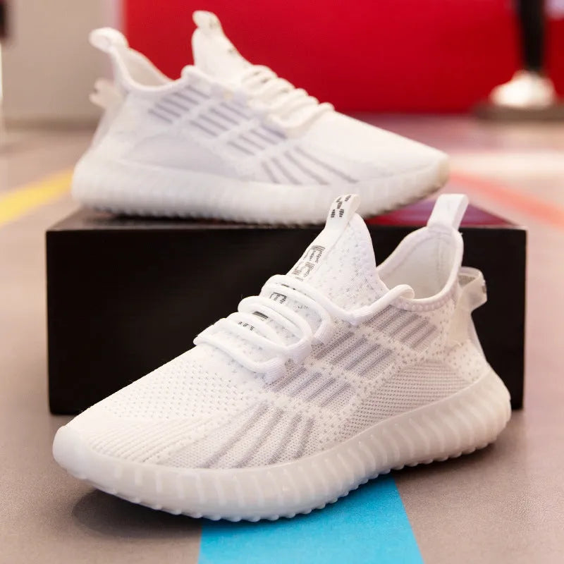 Men's white breathable flying fabric sports shoes with mesh lining and round toe.