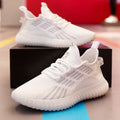 Men's white breathable flying fabric sports shoes with mesh lining and round toe.