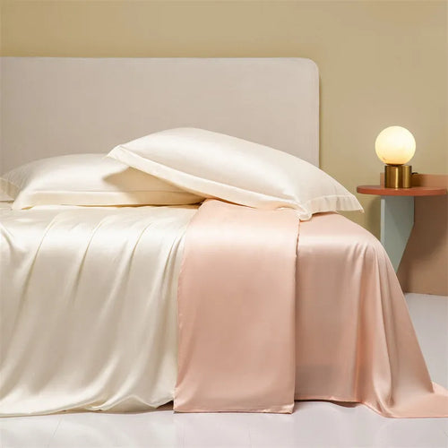 Aurora Blue 200 thread count Tencel duvet cover, fitted sheet, and pillowcases laid on a modern bed.