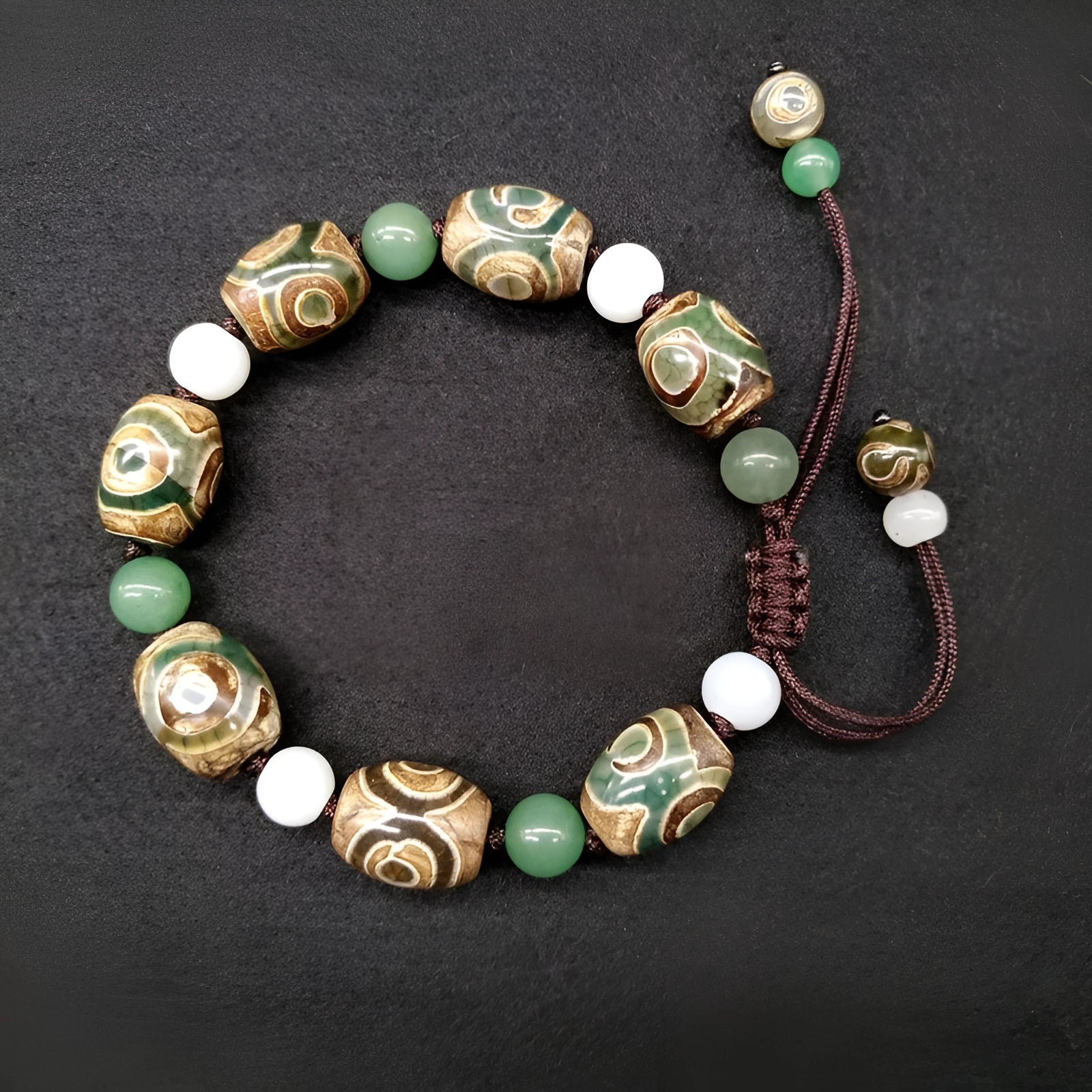 Green agate ethnic bracelet with hand-woven Tibetan beads on black stretch cord