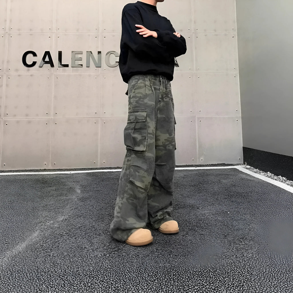 American Vintage cargo pants in washed camouflage colour with multiple pockets and a mid-waist fit.