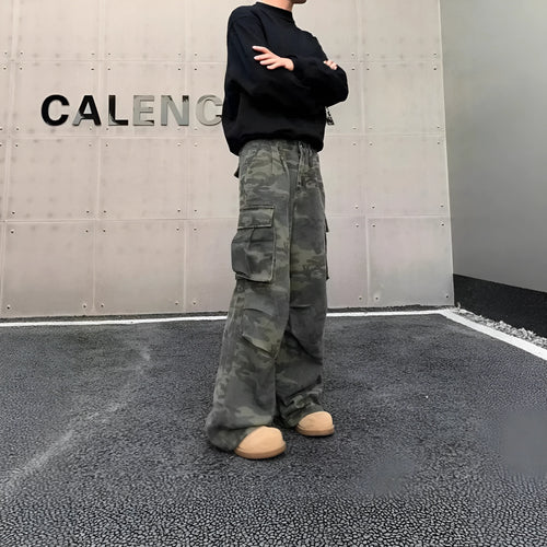 American Vintage cargo pants in washed camouflage colour with multiple pockets and a mid-waist fit.