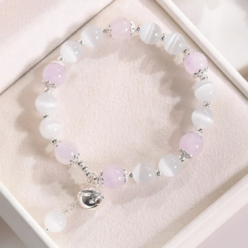 Close-up of electroplated opal cat's eye beaded bracelet for women with diamond-shaped charm