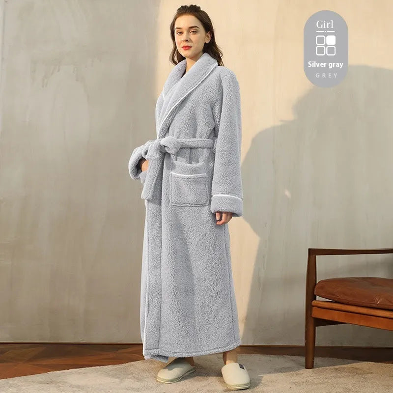 A man and woman wearing matching heavyweight navy blue flannel bathrobes, a couple's winter nightgown set.