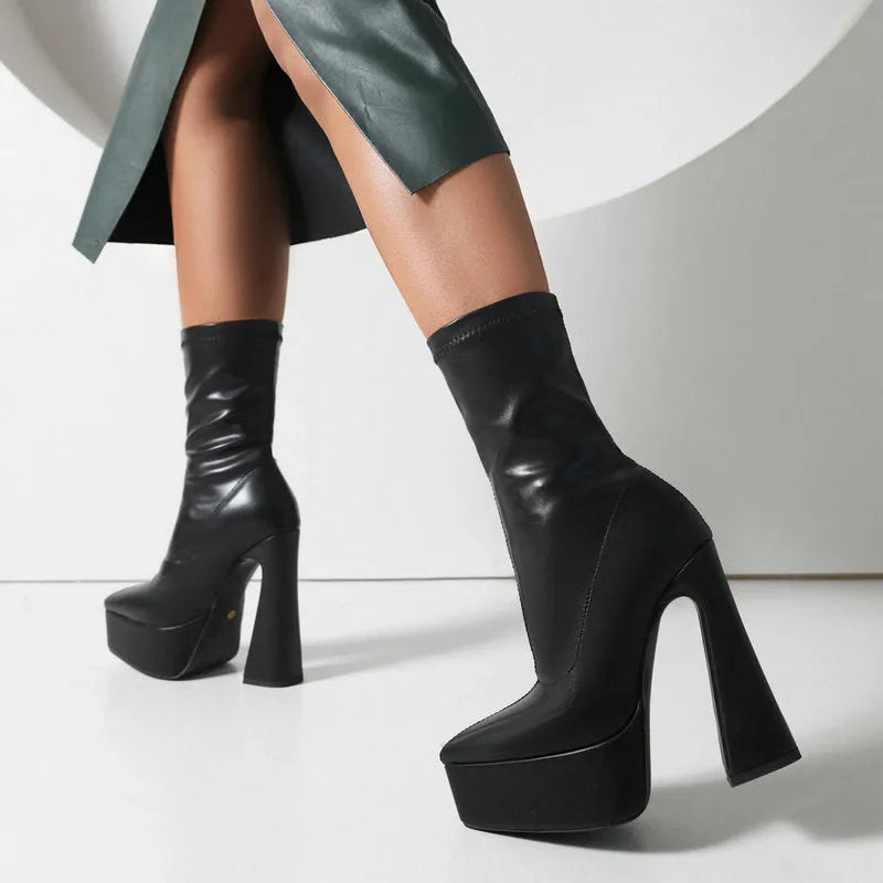 Women's black platform booties with thick super high heel and short stout heel