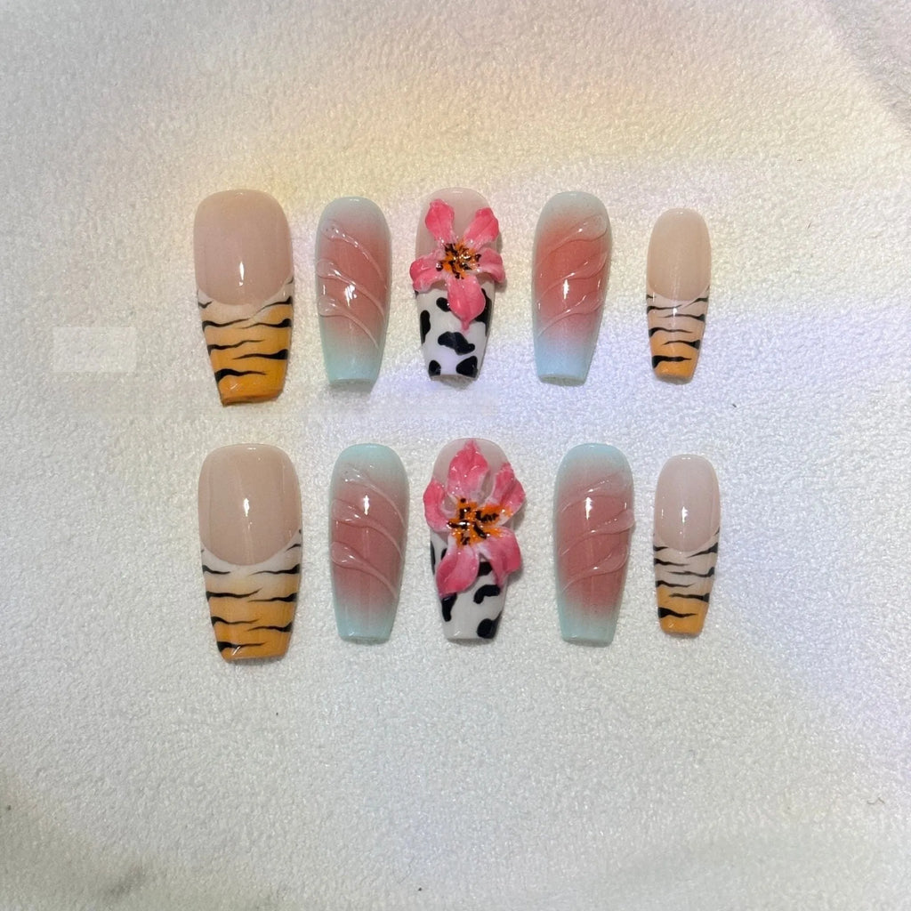 Set of false nails with hand-carved zebra pattern and lily design, showing sizes XS S M L and leopard print styles.
