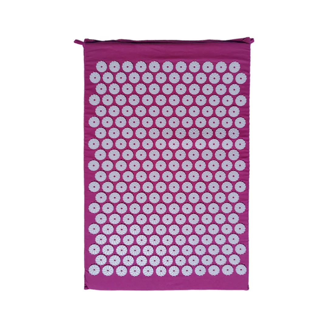 Black and blue acupuncture massage mat set with cushion and headrest on floor for yoga and massage
