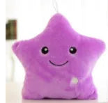 Colourful glowing five-pointed star plush pillow on a dark background, showing soft texture and LED illumination