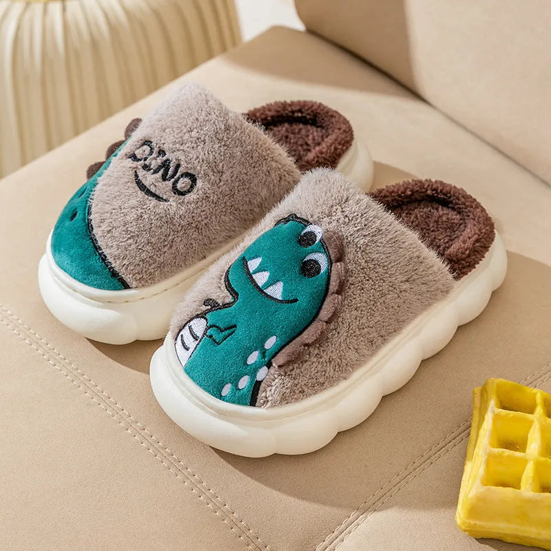 A pair of plush cotton couple slippers in a dinosaur colour pattern, showing the thickened sole.