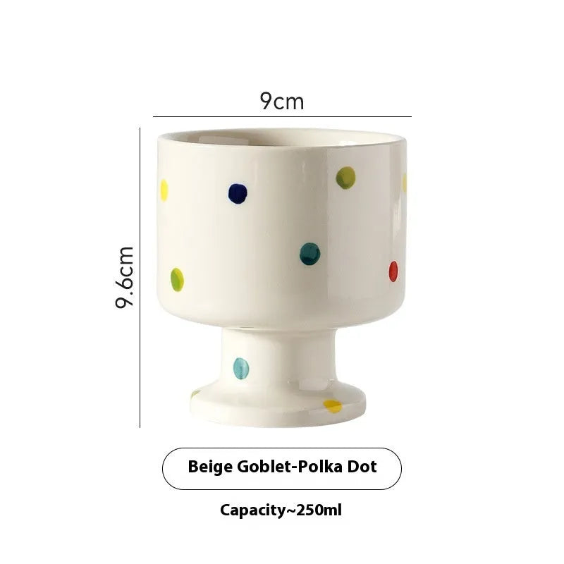 Irregularly shaped hand-pinched ceramic mug in a solid colour, shown on a plain background.