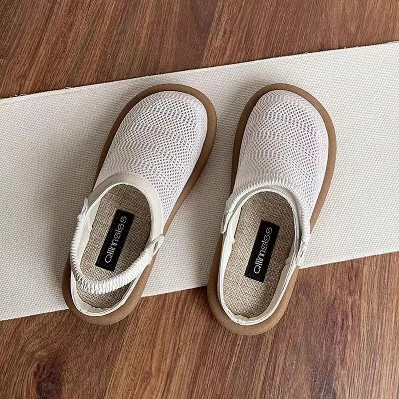 Women's beige linen slip-on shoes with mesh lining, round toe, and rubber sole on a neutral background.