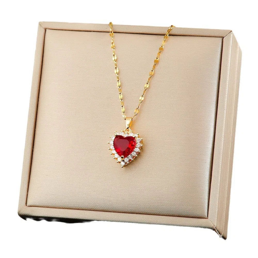 Titanium steel heart jewellery set in gold and red with necklace, ear studs and ring options