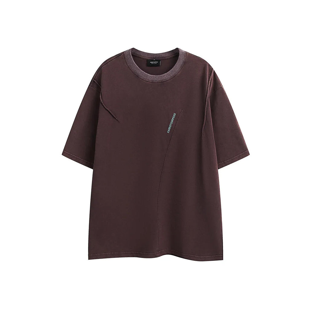 Black and purple loose-fit cotton T-shirt with embroidered design on the front.