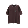 Black and purple loose-fit cotton T-shirt with embroidered design on the front.