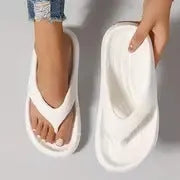 Women's thick-soled EVA flip-flops in black, white, or grey colours with non-slip sole design