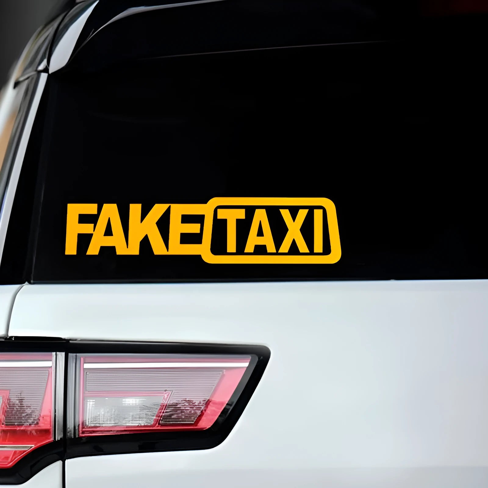Yellow 'FAKE TAXI' waterproof PET car warning sticker measuring 20cm by 8cm.