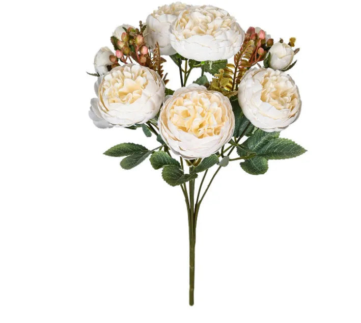 Artificial silk peony bouquet in a vase, showing realistic pink and champagne coloured blooms for home decor.