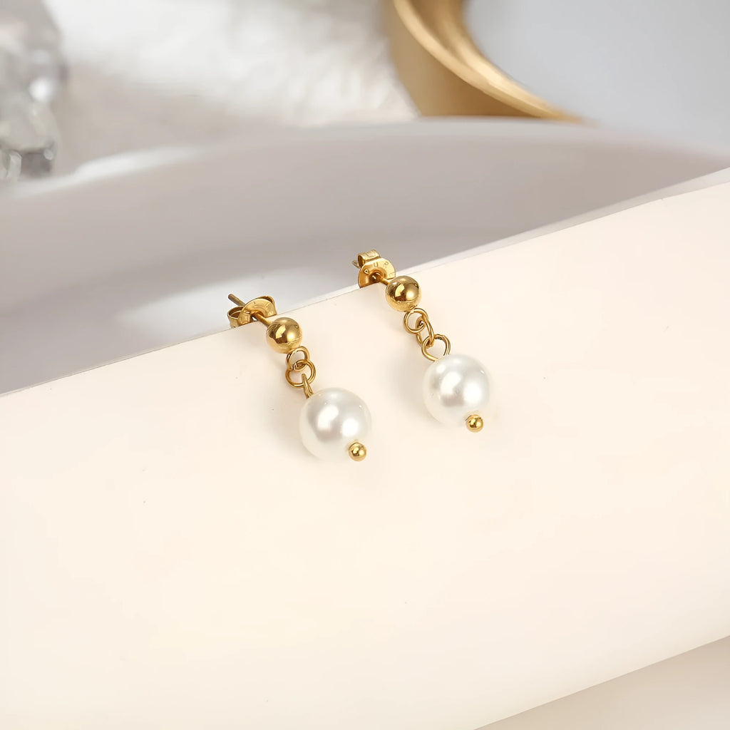 Women's C-shaped titanium steel earrings with pearl inlay flower design in gold