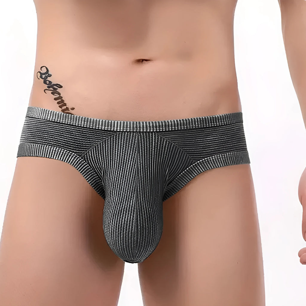 Men's low waist cotton briefs with hollow back design in red, black, blue, white, light green, grey red, or pink.