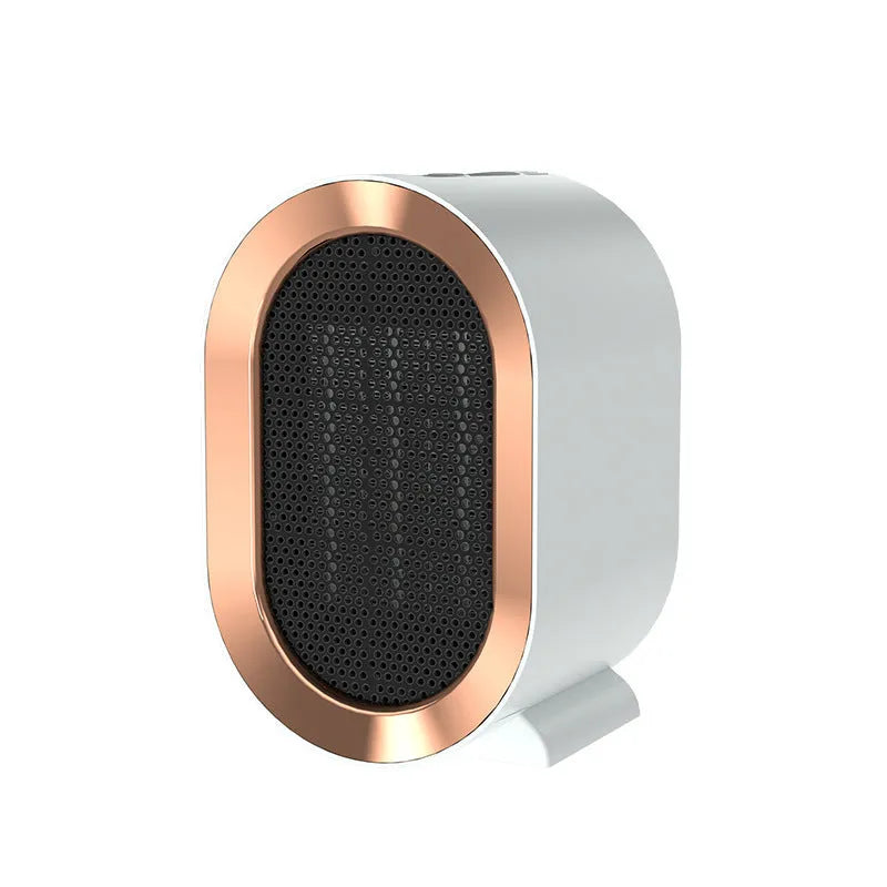 Compact black desktop electric fan heater with a front grille and mechanical control dials.