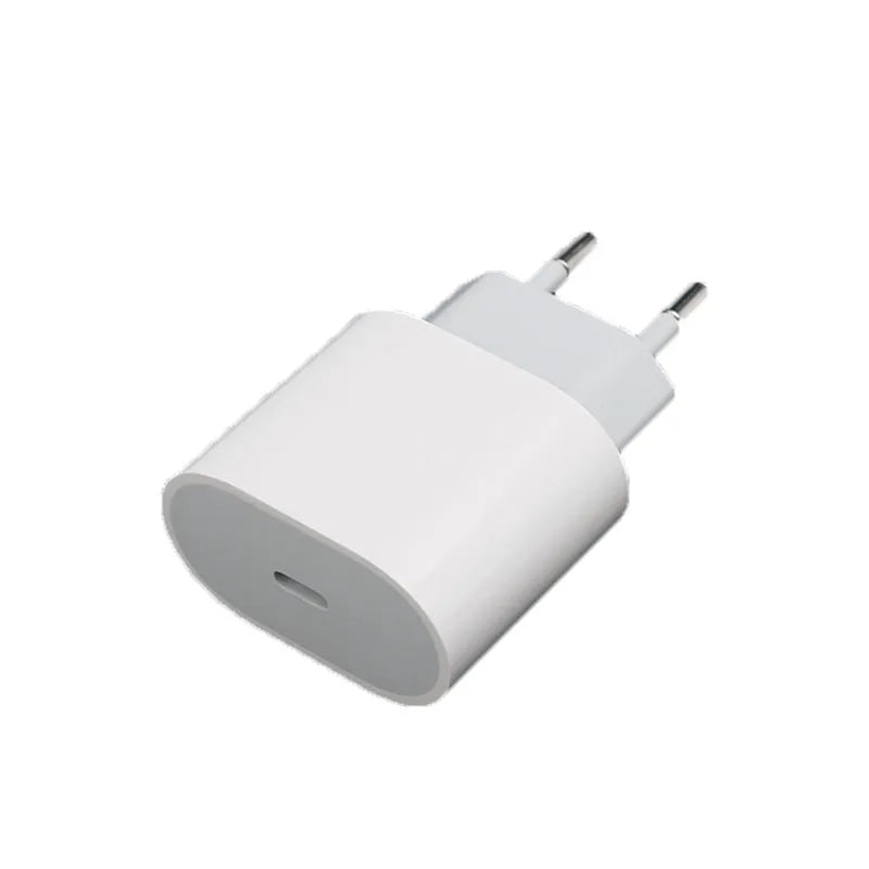 White USB mobile phone charger with detachable European and American plug heads on a grey background