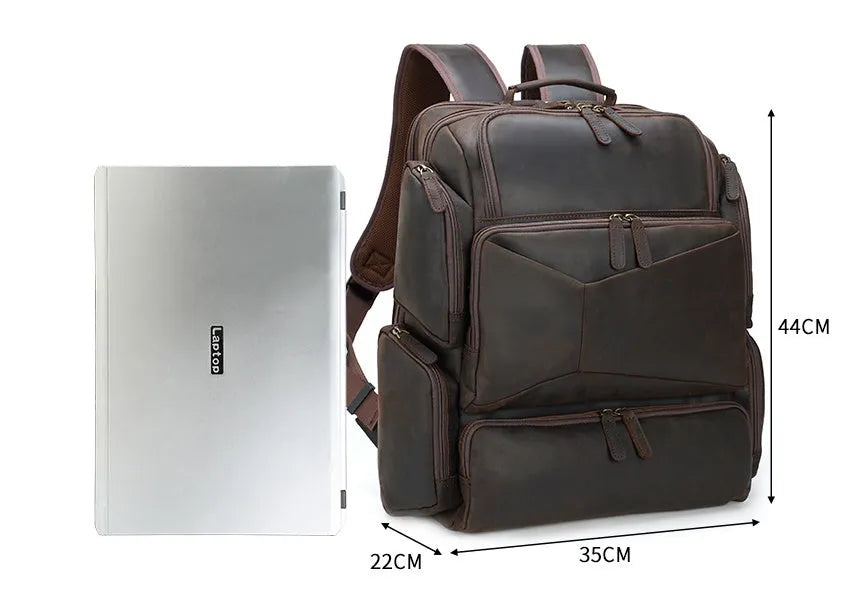Dark brown genuine crazy horse leather backpack for men showing open pockets and organised internal compartments for a 17-inch laptop.
