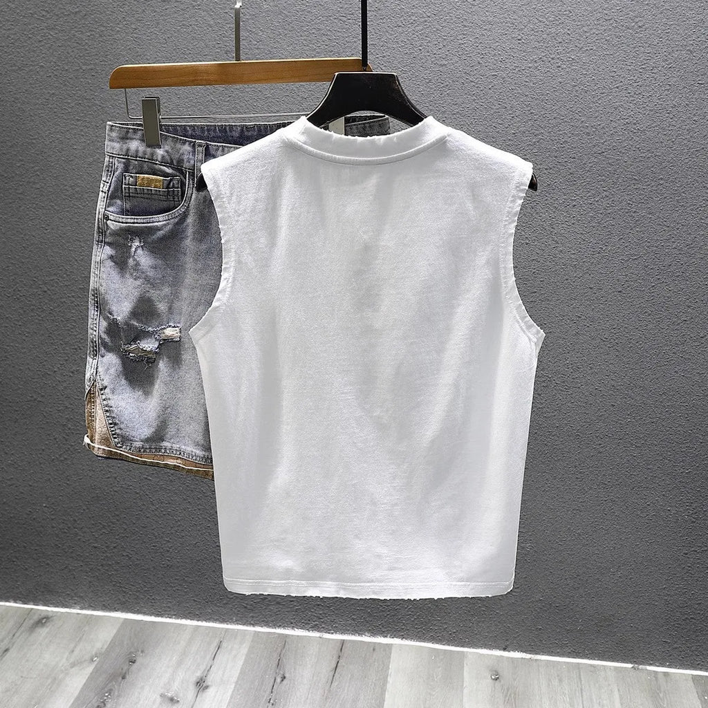 Men's solid black cotton sleeveless t-shirt with loose fit and straight hem on a white background.