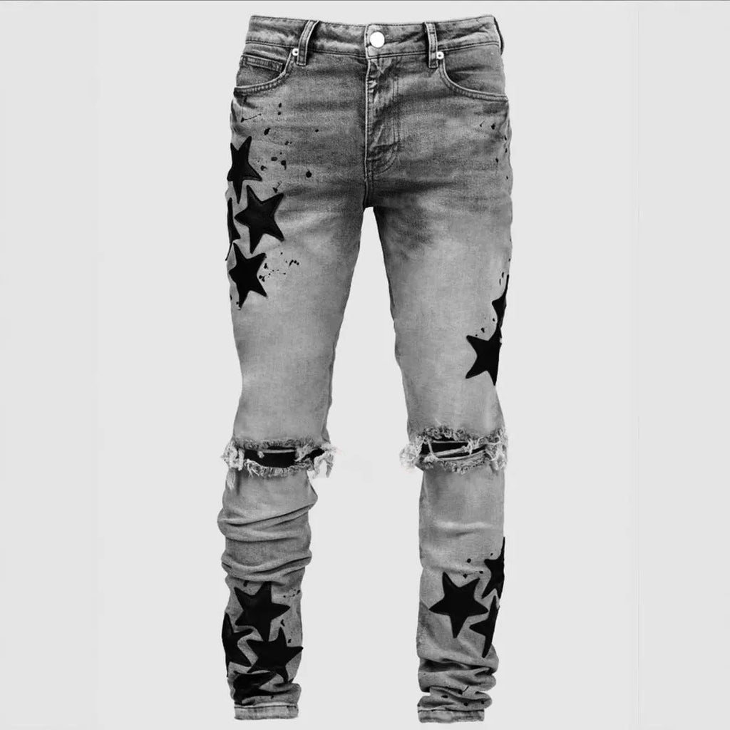 Men's slim stretch blue jeans with embroidery detail on denim fabric.