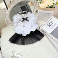 White yarn gauze skirt for small dog on a table, showing princess-style tiered design and lightweight fabric.