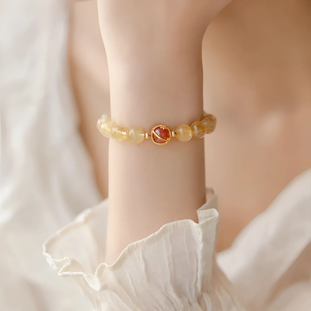 Natural citrine and gold rutilated quartz crystal bracelet with diamond-shaped beads