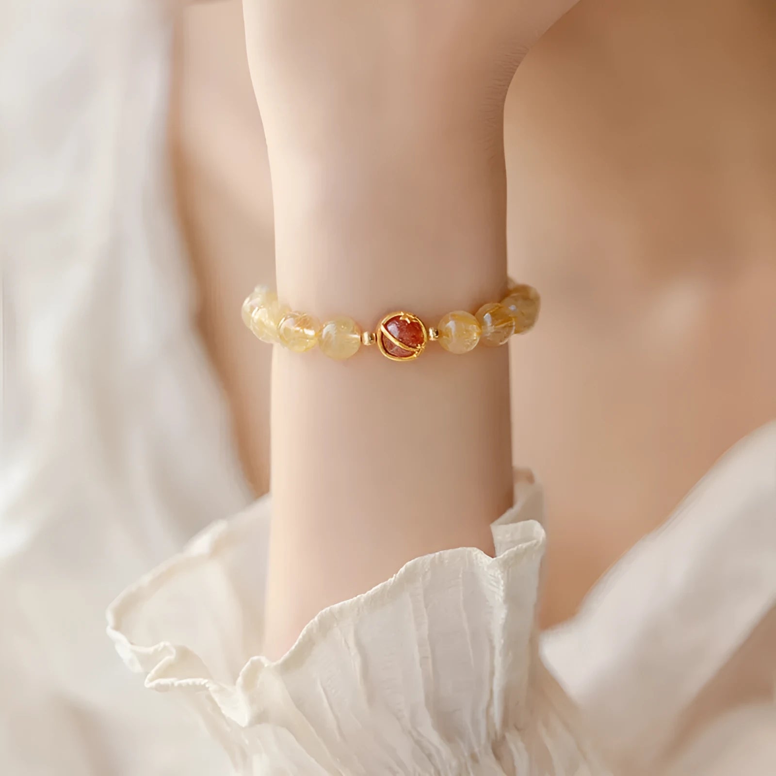 Natural citrine and gold rutilated quartz crystal bracelet with diamond-shaped beads