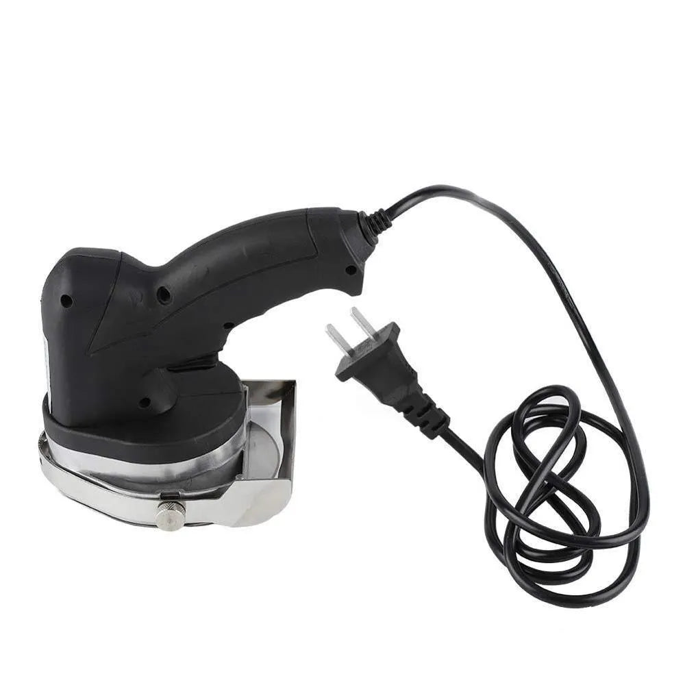 Black KS-100E electric meat cleaver appliance on a counter, showing its blade and compact 150x200x270mm body.