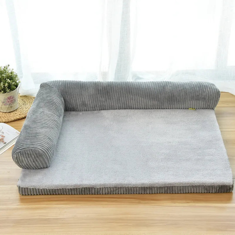 Corduroy pet dog sofa with bolster sides on a non-slip cloth base, shown in grey colour.