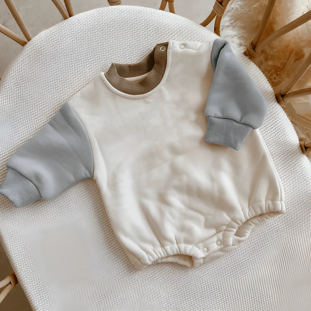 Baby romper in cotton triangle jumpsuit style with hidden hook closure, autumn weight, available in multiple colours