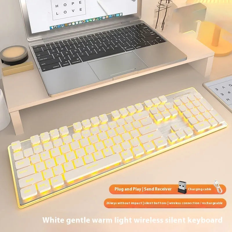 Wireless Bluetooth keyboard with mute button in cherry blossom pink colour on desk