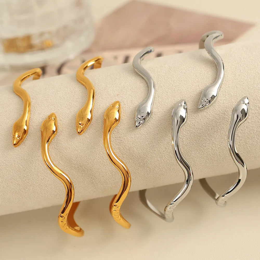 Niche Minimalist Open-end Gold Ripple Line Bracelet on wrist showing ripple texture and electroplated finish.