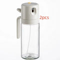Warm grey glass oil sprayer bottle with switchable cover for spray and pour modes