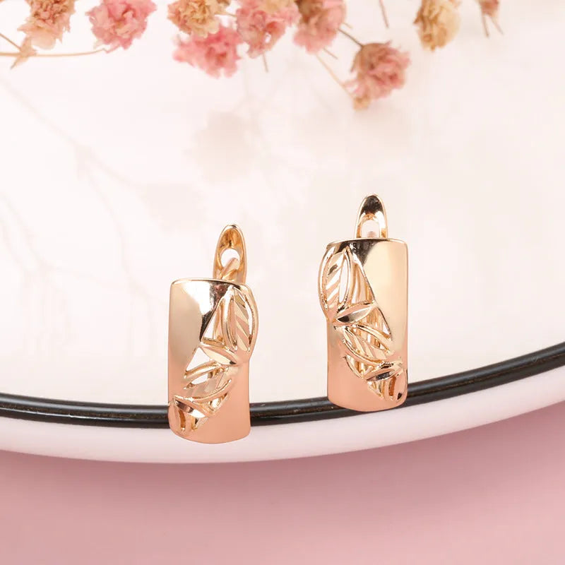 Hollow-carved floral copper earrings with smooth surface and U-shaped design in H0147 colour