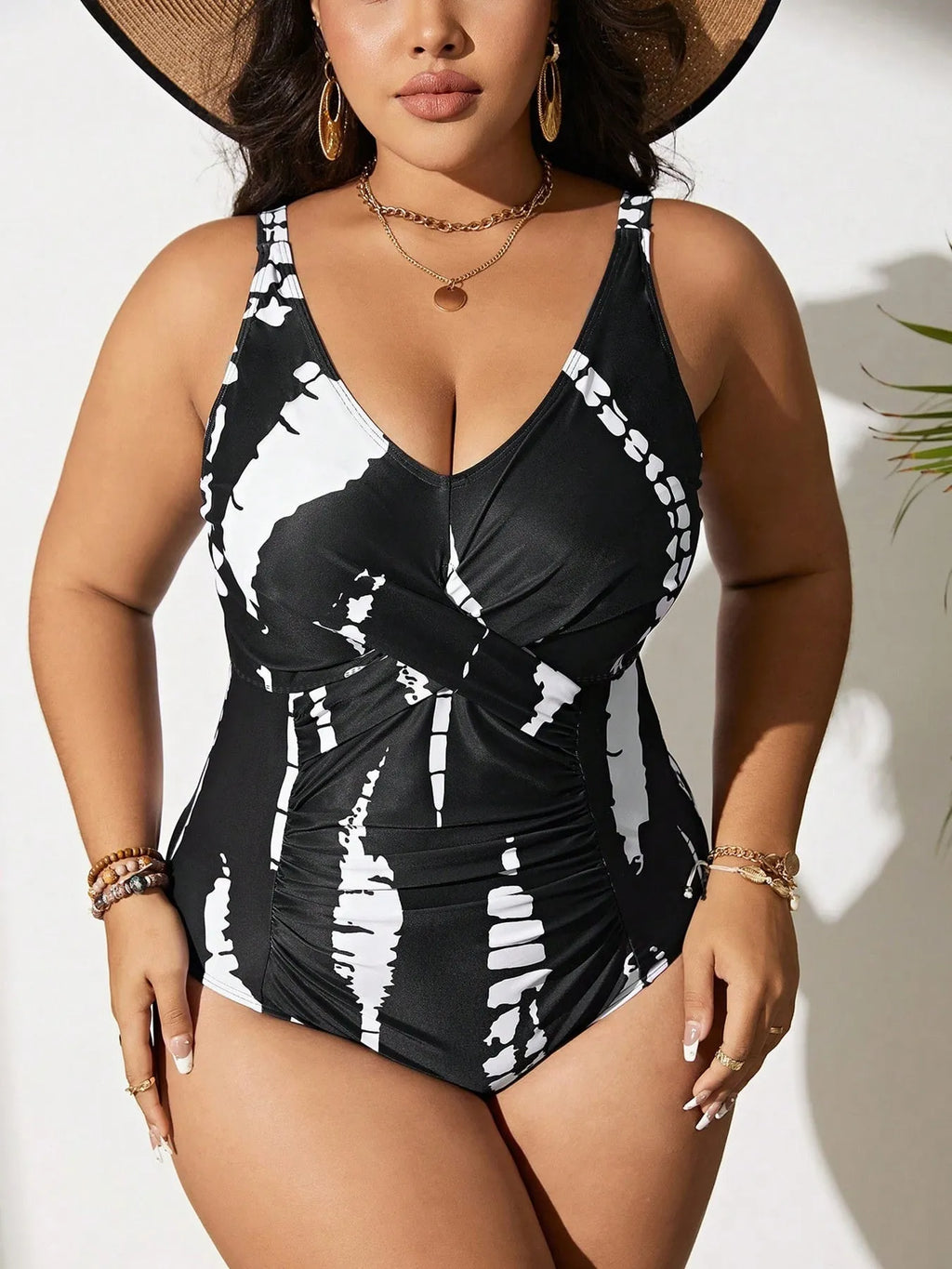 Black colour matching one-piece swimsuit with conservative cut and sleeveless design on mannequin