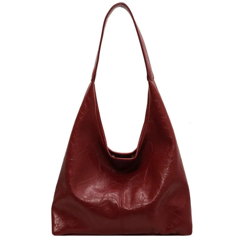 Soft leather large capacity casual shoulder bag with zip closure in multiple colour options.