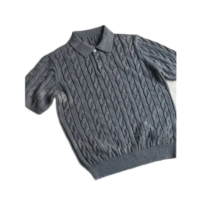 Man wearing a grey knitted short-sleeve T-shirt made from twisted combed cotton blend.