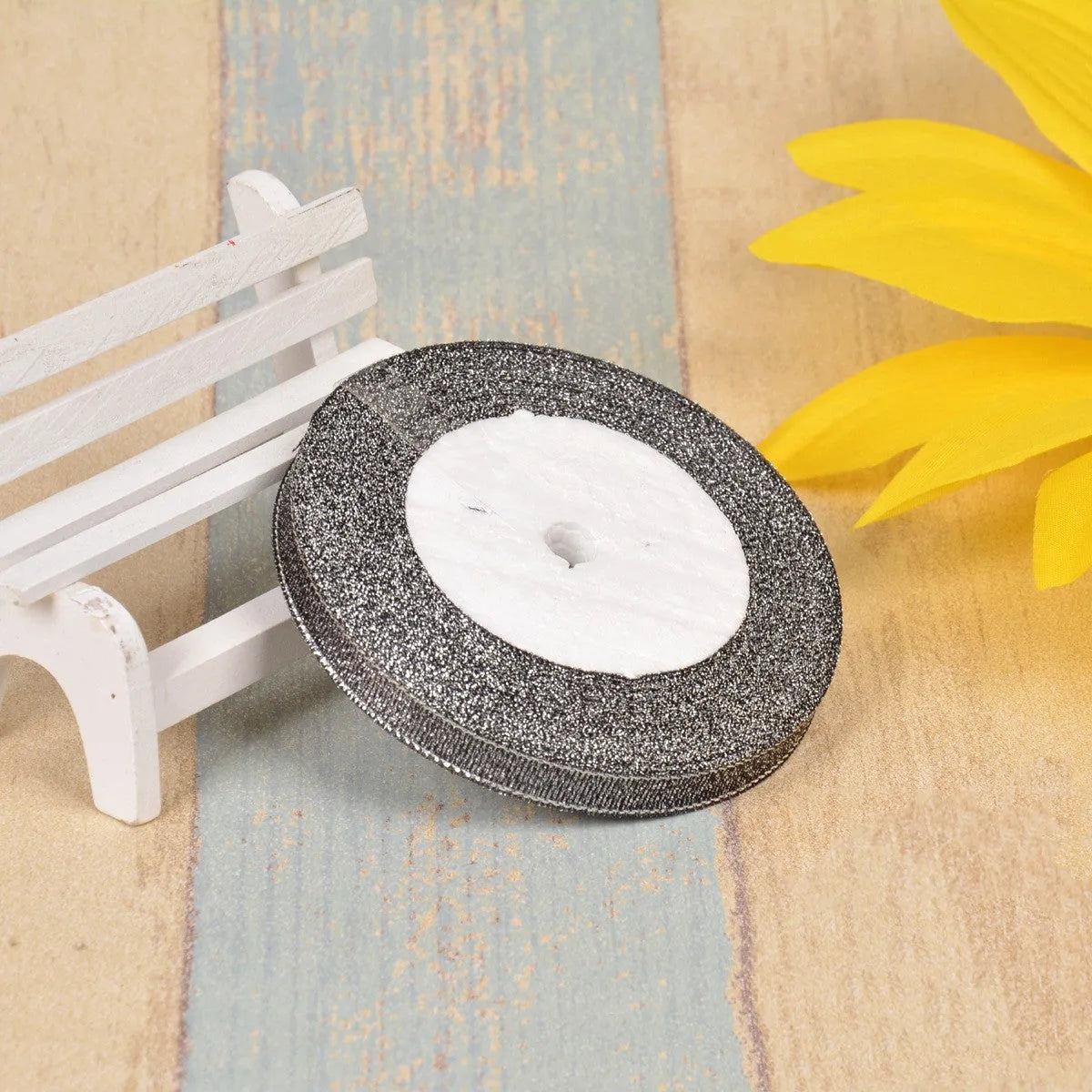 Colourful green onion pattern polyester ribbon spool with metallic gold or silver wire detailing.
