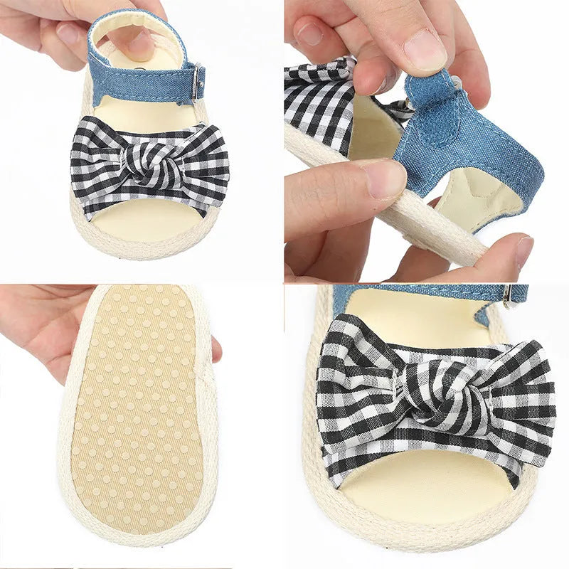 White and black velcro baby shoes showing adjustable straps and low-cut design for toddlers