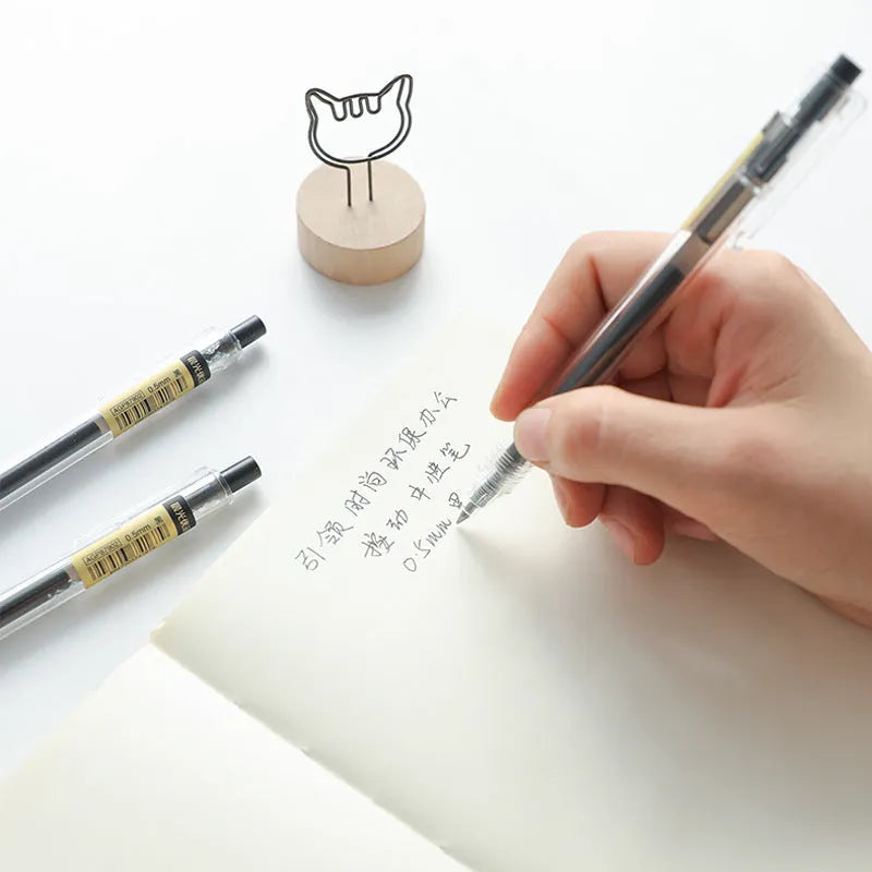 Set of twelve black retractable gel pens with frosted matte barrels and two spare refills.