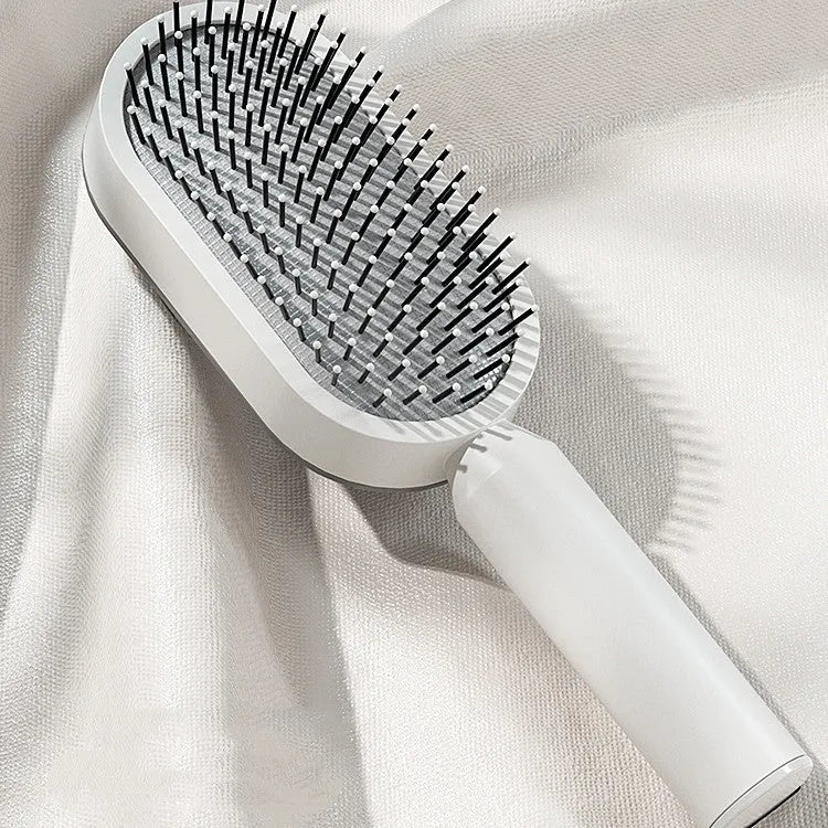 Self cleaning hair brush with one-key cleaning button and air cushion massage design in various colour options