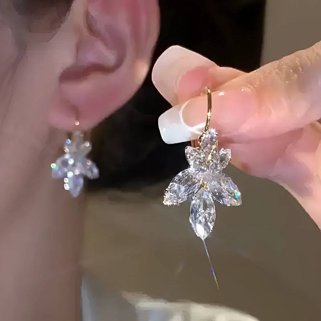 Platinum colour leaf-shaped earrings with inlaid zircon stones