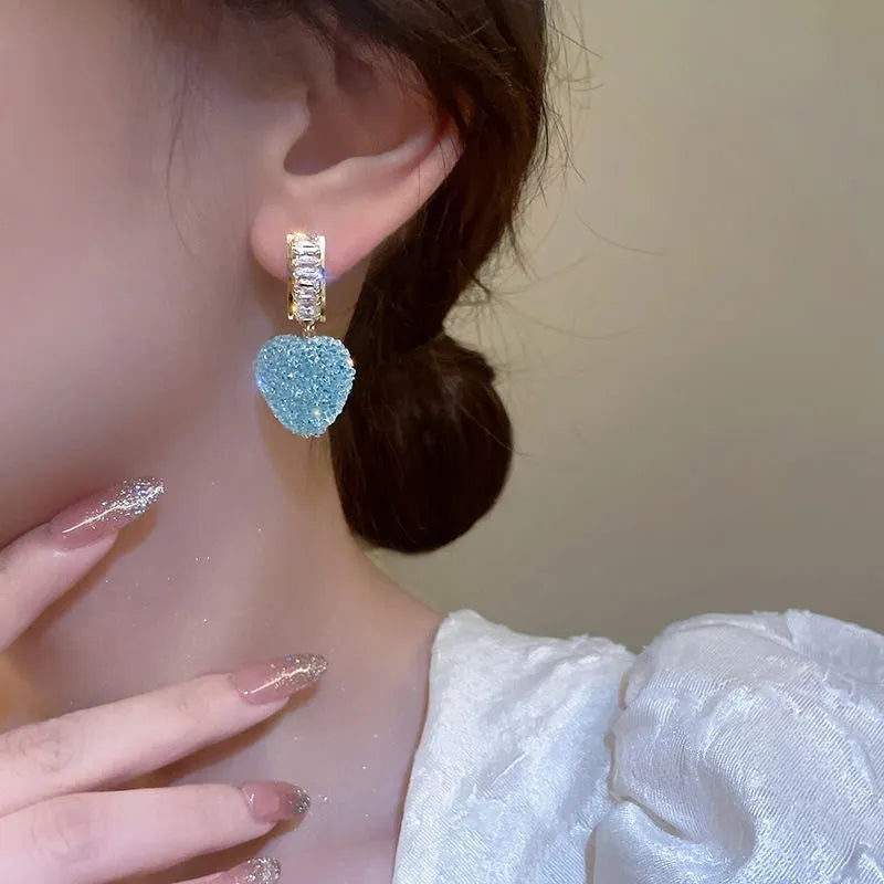 Peach heart-shaped alloy earrings for women in pink or blue candy stud styles