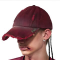 Rose red distressed peaked baseball cap with adjustable back strap and spray-painted vintage finish