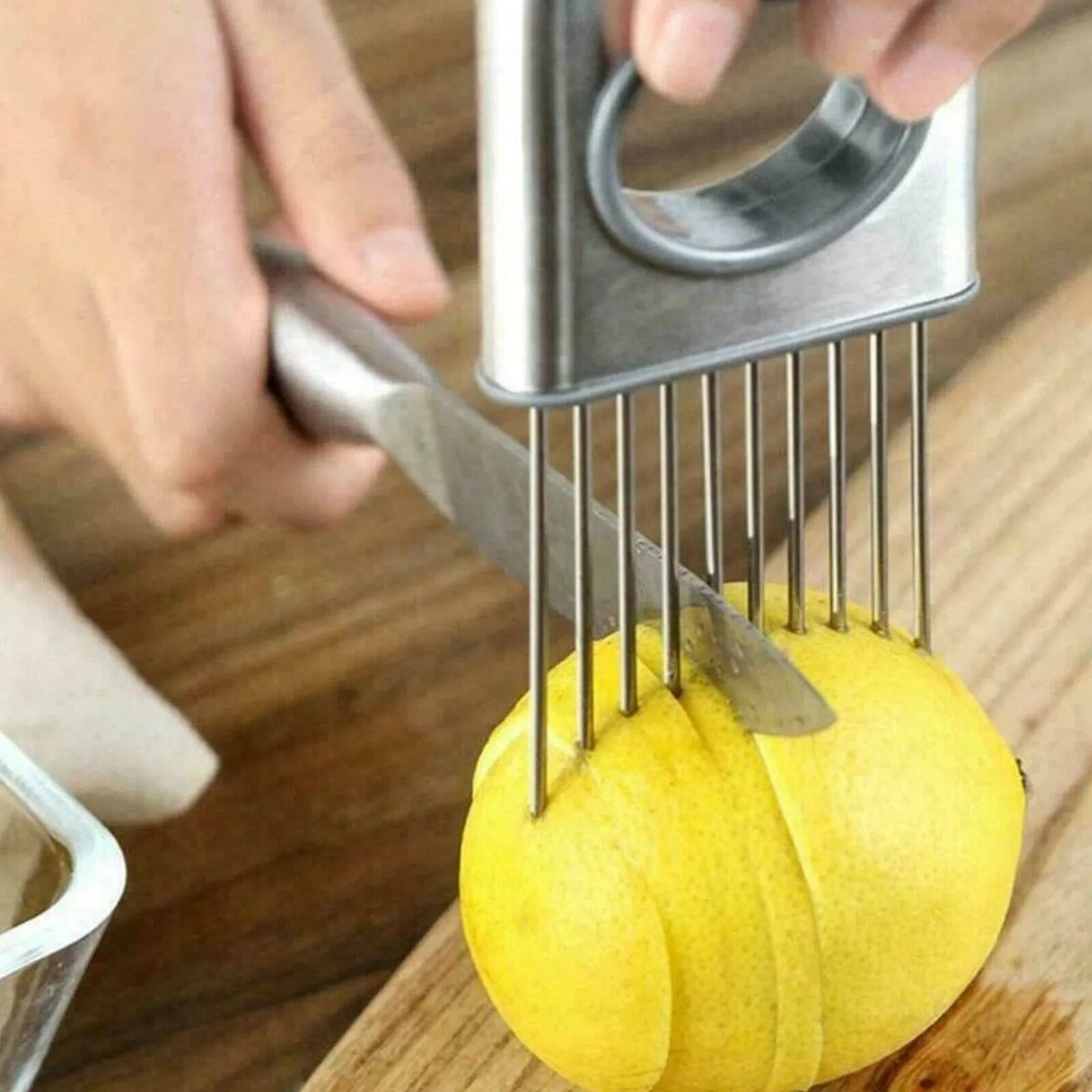 Stainless steel onion holder with sharp prongs and finger guard for vegetable slicing